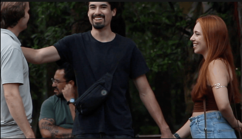 Two men in relaxed conversation outdoors